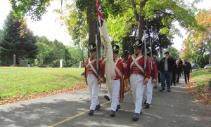 100th Regiment re-enactors lead march to Bradley grave.