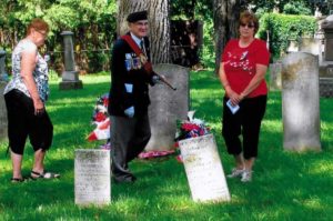 Sgt. At Arms Ted Jablonski of the Royal Canadian Legion Battlefield Branch 622 and 3rd great granddaughters, Lois Smagata and Brenda Denyes , unveil the Graveside War of 1812 Plaque and lay wreaths.